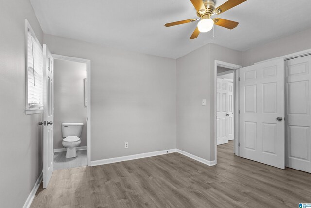 4 Carriage Rd, Anniston, AL 36206 - unfurnished bedroom with wood finished floors, ensuite bathroom, and a ceiling fan