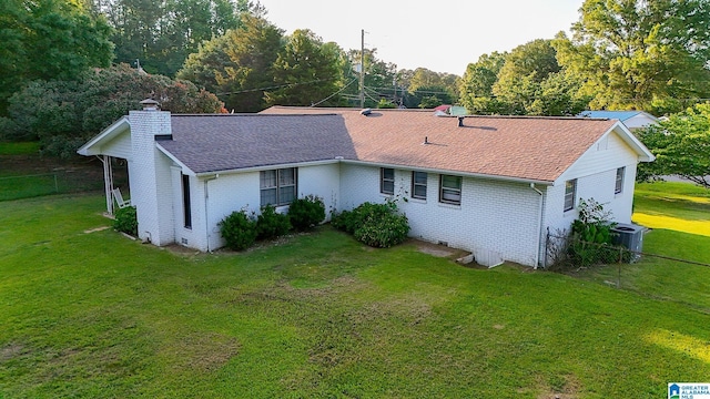 4 Carriage Rd, Anniston, AL 36206 - view of front facade featuring a chimney, brick siding, and a shingled roof