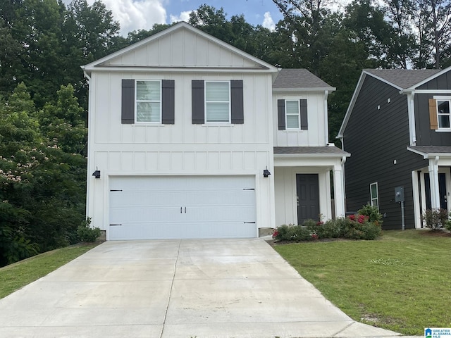 6534 Creek Cir, Helena, AL 35022 - view of front of home with board and batten siding, driveway, a garage, a front lawn, and a shingled roof
