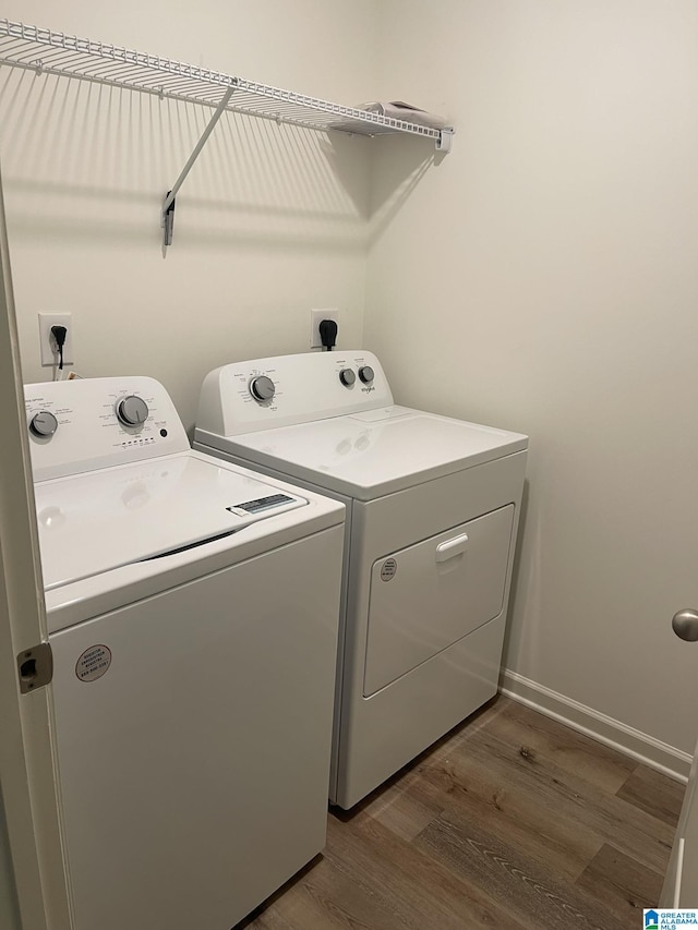 6534 Creek Cir, Helena, AL 35022 - washroom featuring separate washer and dryer and dark wood-style flooring