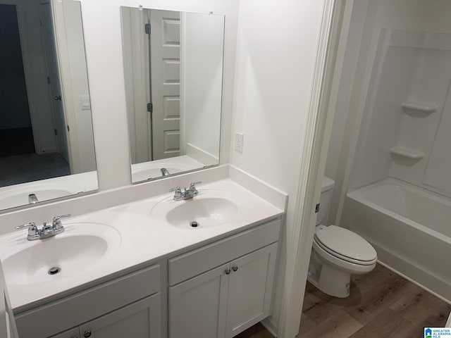 6534 Creek Cir, Helena, AL 35022 - bathroom featuring wood finished floors, double vanity, and bathtub / shower combination