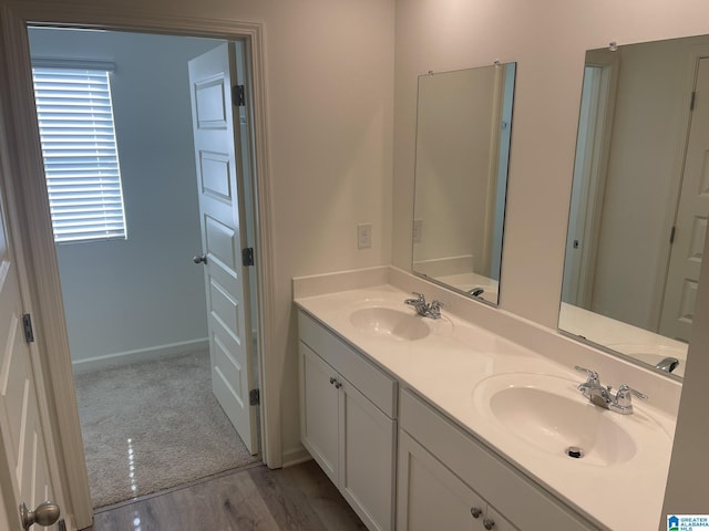 6534 Creek Cir, Helena, AL 35022 - bathroom featuring double vanity and wood finished floors