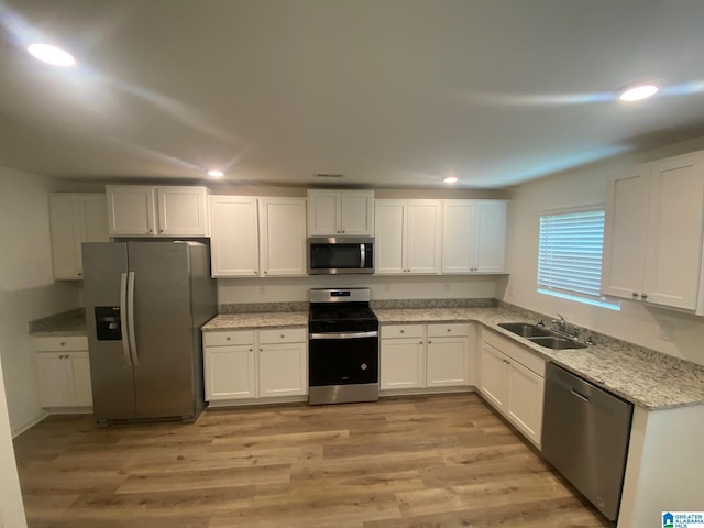 6534 Creek Cir, Helena, AL 35022 - kitchen with appliances with stainless steel finishes, recessed lighting, and white cabinetry