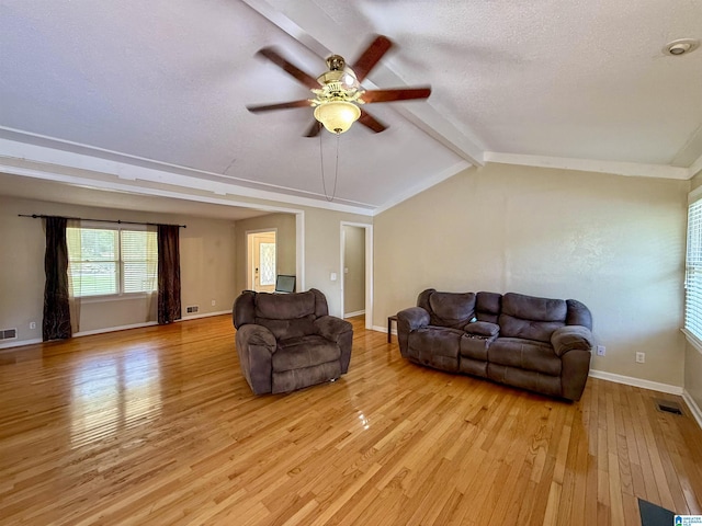 1027 Creek Trl, Anniston, AL 36206 - living room featuring a ceiling fan, light wood finished floors, and a textured ceiling
