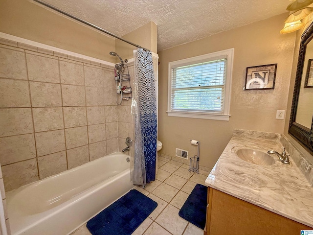 1027 Creek Trl, Anniston, AL 36206 - bathroom featuring tile patterned flooring, vanity, shower / bath combination with curtain, and a textured ceiling