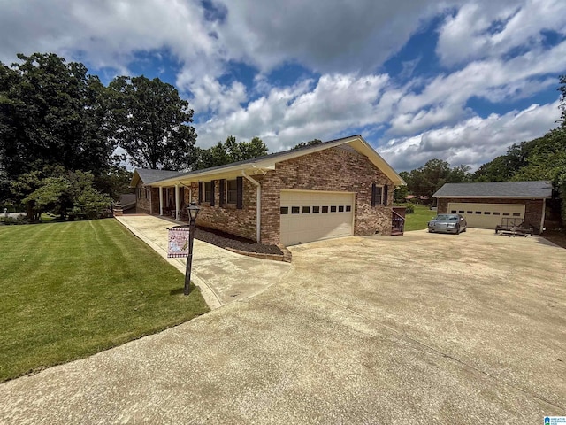 1027 Creek Trl, Anniston, AL 36206 - ranch-style house featuring a front lawn, brick siding, driveway, and an attached garage
