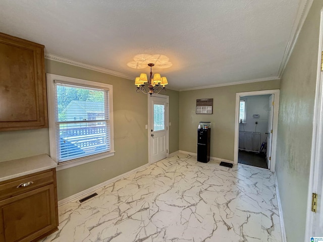 1027 Creek Trl, Anniston, AL 36206 - unfurnished dining area with a chandelier, healthy amount of natural light, light marble finish floors, crown molding, and a textured ceiling