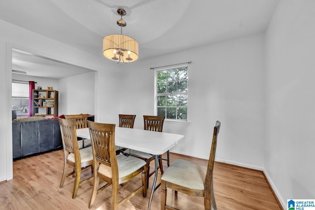 509 Lasalle Ln, Irondale, AL 35210 - dining area with light wood-style flooring and a chandelier