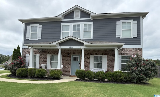4486 Old Cahaba Pkwy, Helena, AL 35080 - view of front facade featuring brick siding, a front yard, and covered porch