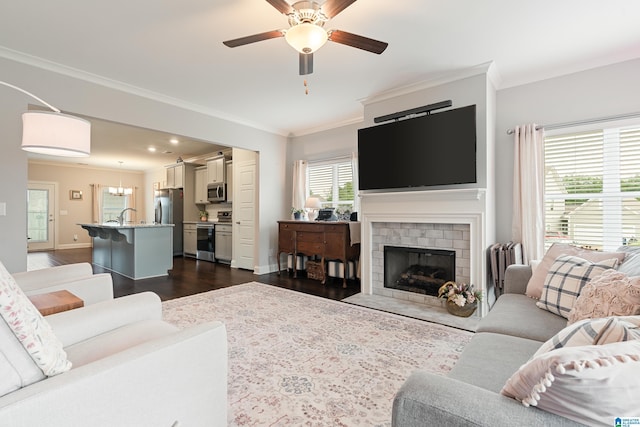 4486 Old Cahaba Pkwy, Helena, AL 35080 - living room with ornamental molding, dark wood-style flooring, a ceiling fan, and a brick fireplace