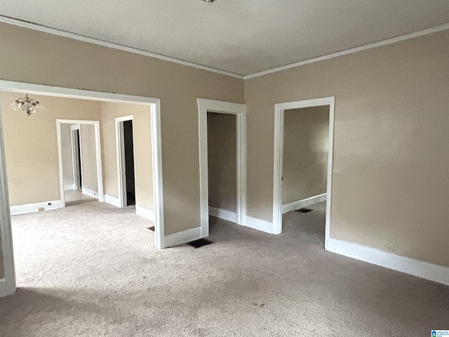 2511 20th Pl, Ensley, Birmingham, AL 35208 - spare room featuring ornamental molding, carpet floors, and a chandelier