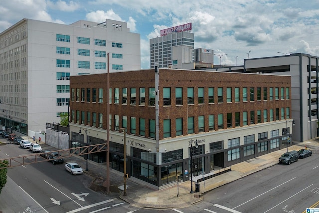 1801 2nd Ave N Unit 415, Birmingham, AL 35203 - view of building exterior with a city view and uncovered parking