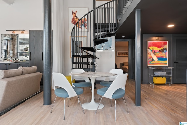 1801 2nd Ave N Unit 415, Birmingham, AL 35203 - dining area featuring stairs, wood finished floors, and recessed lighting