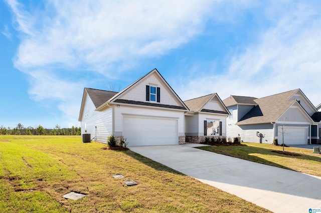 150 Sanie Cove Ln, Margaret, AL 35120 - view of front of house featuring concrete driveway, a front yard, and stone siding