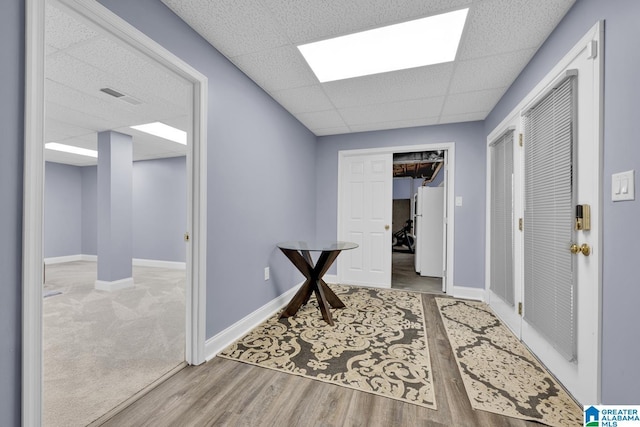 5557 Lakes Edge Dr, Hoover, AL 35242 - corridor with a drop ceiling and wood finished floors