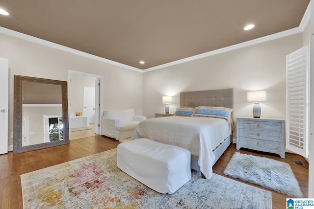 5557 Lakes Edge Dr, Hoover, AL 35242 - bedroom with ornamental molding, wood finished floors, recessed lighting, and ensuite bath