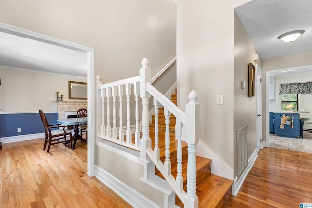 505 Waterside Cir, Mccalla, AL 35111 - staircase featuring wood finished floors and baseboards