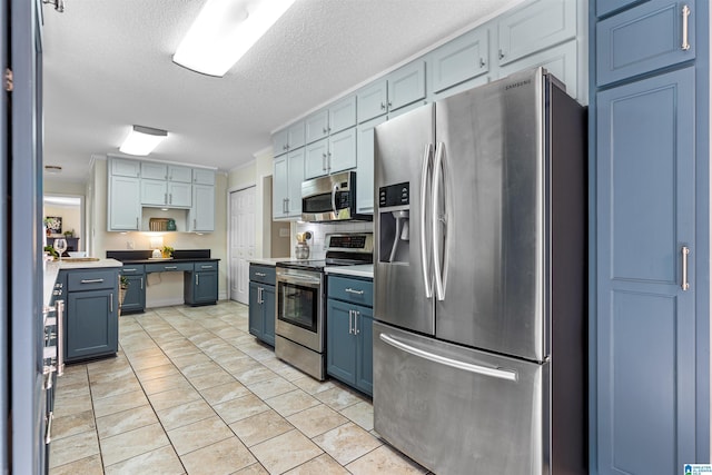 505 Waterside Cir, Mccalla, AL 35111 - kitchen featuring stainless steel appliances, blue cabinetry, open shelves, a textured ceiling, and light tile patterned flooring