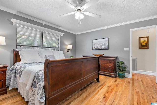 505 Waterside Cir, Mccalla, AL 35111 - bedroom with light wood-type flooring, crown molding, a textured ceiling, and a ceiling fan