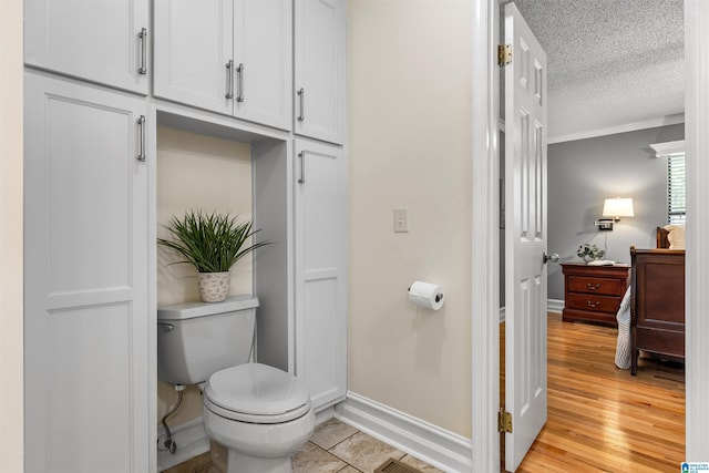 505 Waterside Cir, Mccalla, AL 35111 - bathroom with a textured ceiling and wood finished floors