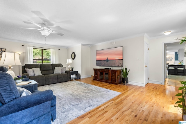 505 Waterside Cir, Mccalla, AL 35111 - living area featuring a ceiling fan, wood finished floors, and ornamental molding