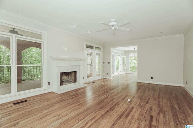 3357 Afton Ln, Birmingham, AL 35242 - unfurnished living room with a ceiling fan, wood finished floors, crown molding, a high end fireplace, and french doors