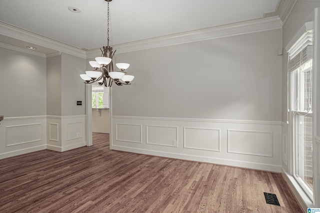 3357 Afton Ln, Birmingham, AL 35242 - unfurnished room with a chandelier, crown molding, a wainscoted wall, wood finished floors, and a decorative wall