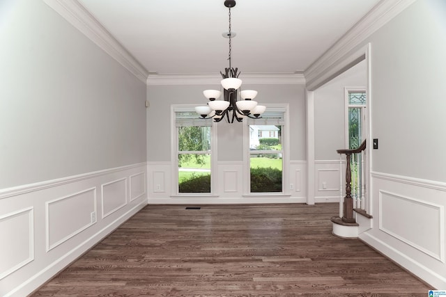 3357 Afton Ln, Birmingham, AL 35242 - unfurnished dining area featuring a chandelier, a decorative wall, ornamental molding, a wainscoted wall, and dark wood-style flooring