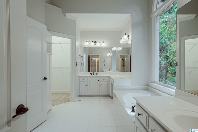 3357 Afton Ln, Birmingham, AL 35242 - bathroom featuring two vanities, crown molding, a garden tub, and a walk in closet