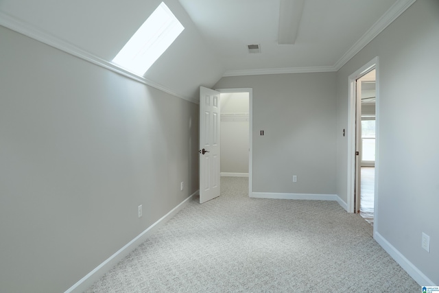 3357 Afton Ln, Birmingham, AL 35242 - unfurnished bedroom featuring a walk in closet, light carpet, ornamental molding, lofted ceiling, and a closet