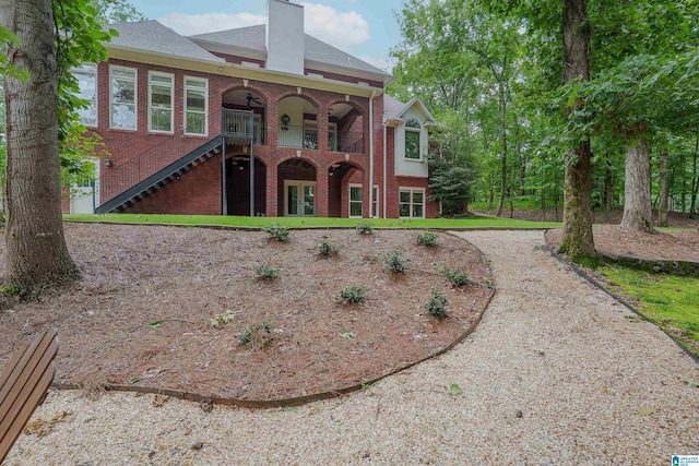 3357 Afton Ln, Birmingham, AL 35242 - view of front of home featuring brick siding, a chimney, french doors, and stairs