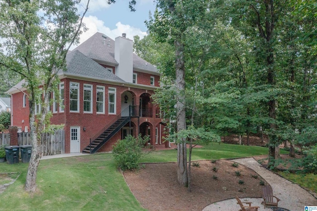 3357 Afton Ln, Birmingham, AL 35242 - back of house featuring brick siding, stairs, a chimney, and a shingled roof