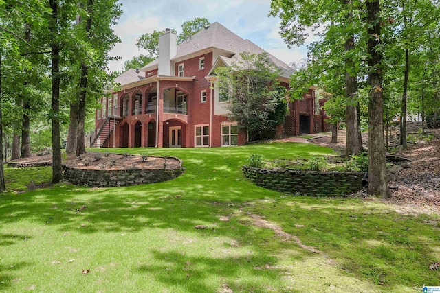 3357 Afton Ln, Birmingham, AL 35242 - back of property with stairs, a yard, brick siding, and a chimney