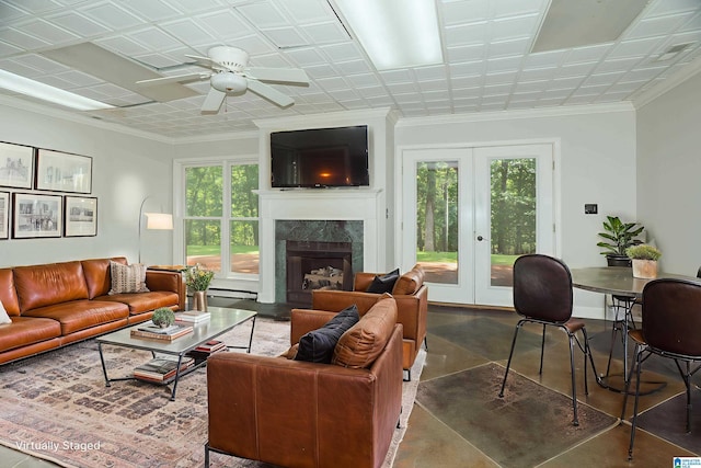 3357 Afton Ln, Birmingham, AL 35242 - living area featuring healthy amount of natural light, french doors, a high end fireplace, ceiling fan, and crown molding