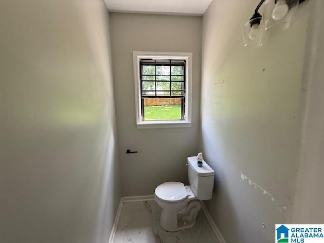 1511 43rd St, Birmingham, AL 35208 - bathroom featuring baseboards and marble look tile flooring