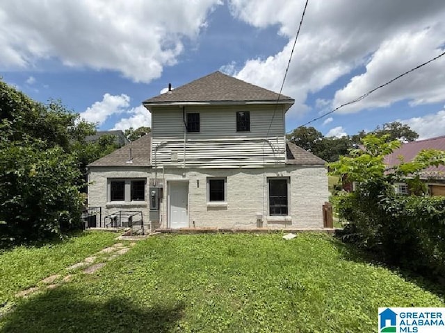 1511 43rd St, Birmingham, AL 35208 - rear view of property with a lawn and a shingled roof