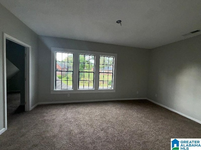 1511 43rd St, Birmingham, AL 35208 - spare room with carpet flooring and baseboards