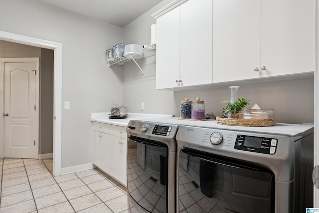 4067 Milners Cres, Hoover, AL 35242 - laundry area featuring washer and clothes dryer, cabinet space, and light tile patterned flooring
