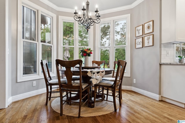 4067 Milners Cres, Hoover, AL 35242 - dining area with a chandelier, light wood finished floors, and ornamental molding