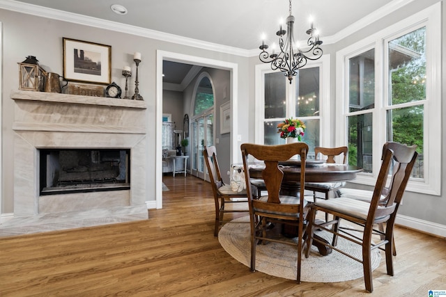 4067 Milners Cres, Hoover, AL 35242 - dining room with a chandelier, ornamental molding, wood finished floors, and a fireplace