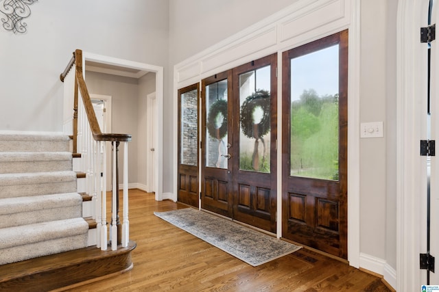4067 Milners Cres, Hoover, AL 35242 - foyer with plenty of natural light, light wood finished floors, and stairs