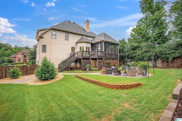 4067 Milners Cres, Hoover, AL 35242 - back of house with a sunroom, outdoor lounge area, a fenced backyard, and stucco siding