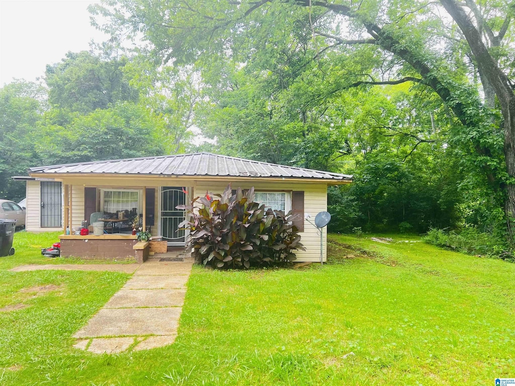 1916 Crescent Ave, Lipscomb, AL 35020 - view of front of home featuring a porch, a front yard, and a metal roof