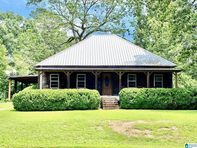 672 Websters Chapel Rd, Wellington, AL 36279 - view of front facade with a front lawn, a porch, and a metal roof