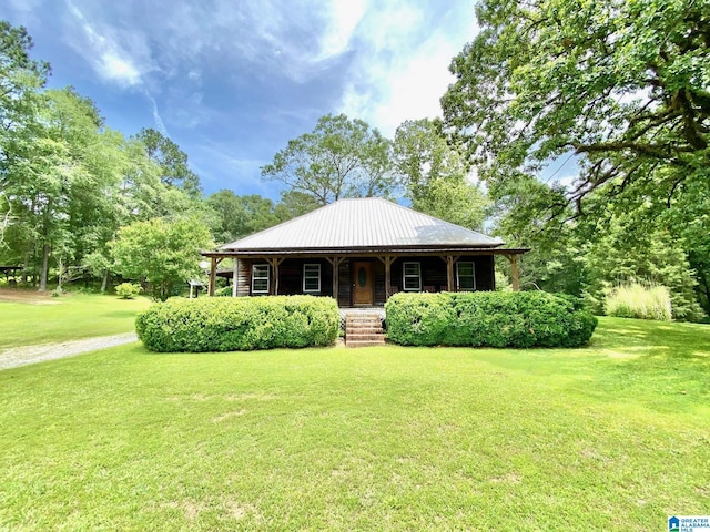 672 Websters Chapel Rd, Wellington, AL 36279 - view of front of property with covered porch, a front yard, and a metal roof