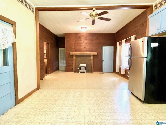 672 Websters Chapel Rd, Wellington, AL 36279 - unfurnished living room featuring light floors, wood walls, and a ceiling fan