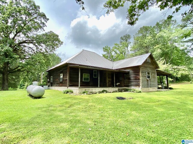 672 Websters Chapel Rd, Wellington, AL 36279 - rear view of house featuring a lawn and a metal roof