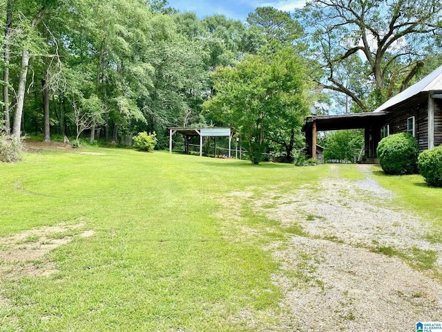 672 Websters Chapel Rd, Wellington, AL 36279 - view of grassy yard with driveway and an attached carport
