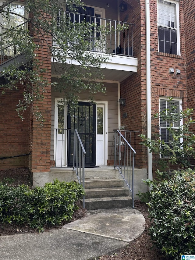 1901 Waterford Pl Unit 1901, Birmingham, AL 35244 - doorway to property featuring a balcony and brick siding