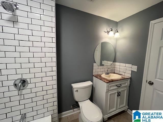 2732 29th St, Birmingham, AL 35208 - full bath featuring vanity, tasteful backsplash, and a tile shower